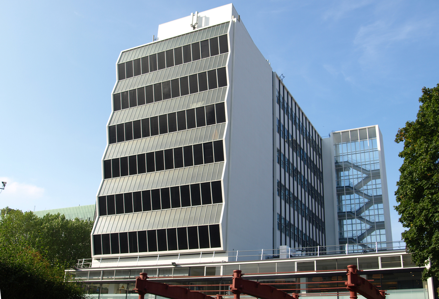 photo of tall building with blue sky in the background